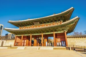 Changdeokgung Palace ornate wooden gate under blue sky