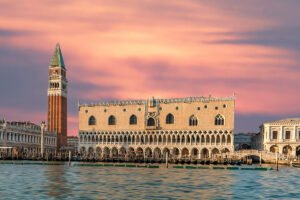 Doge's Palace on Venetian waterfront at sunset