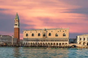 Doge's Palace on Venetian waterfront at sunset