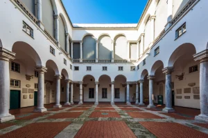 Sunny arched courtyard at Doge's Palace with marble columns