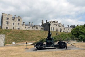 Dover Castle with vintage coastal artillery on lawn
