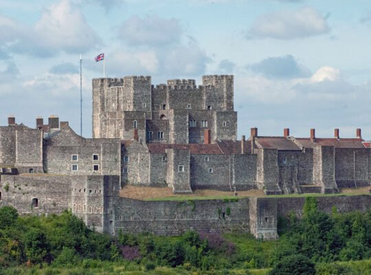 Dover Castle perched above green cliffs and battlements
