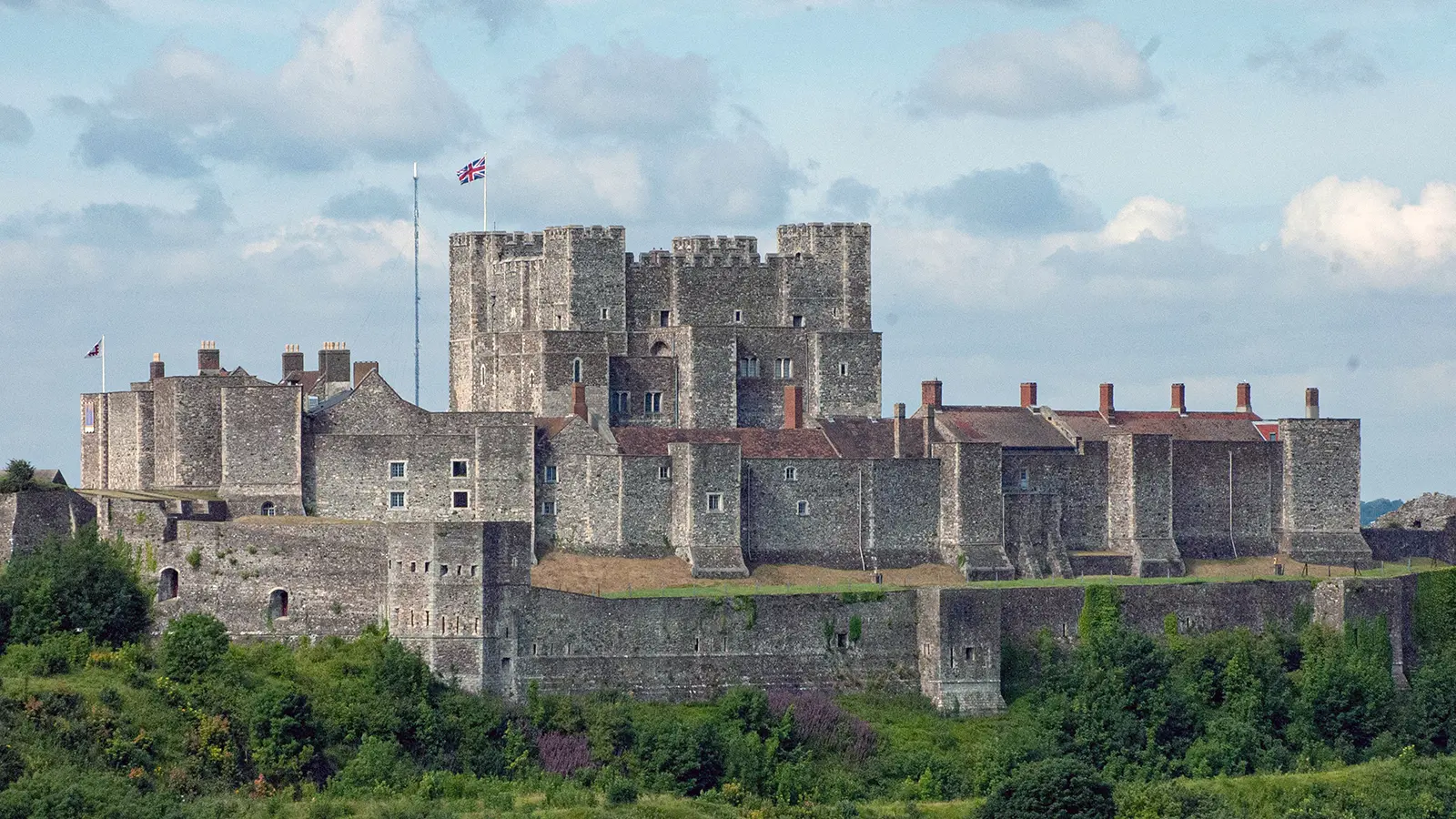 Dover Castle perched above green cliffs and battlements