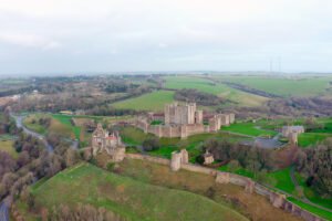 Aerial view of Dover Castle atop white cliffs and green fields