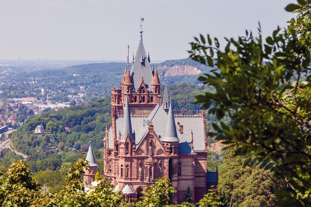 Drachenburg Castle turret and towers overlooking wooded valley