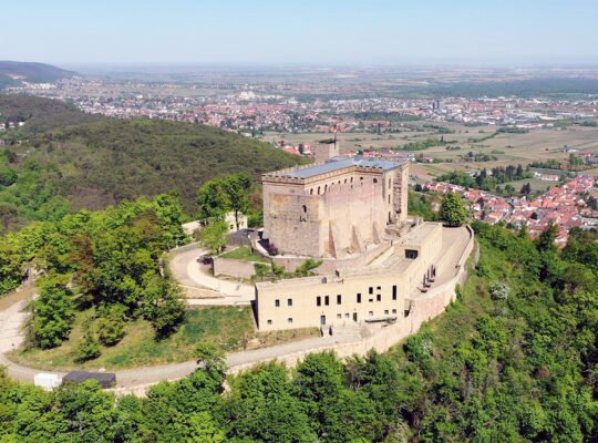 Aerial view of Hambach Castle on wooded hill above Palatinate plains