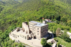 Aerial view of Hambach Castle perched above forested Palatinate hills