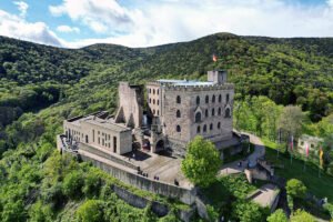 Aerial view of Hambach Castle perched on wooded hilltop