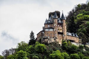 Katz Castle perched on rocky Rhine hillside under overcast sky