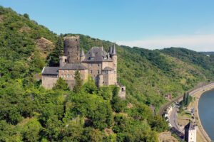 Katz Castle perched on forested Rhine hillside beside the river road