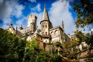 Marienburg Castle from below with towers and greenery