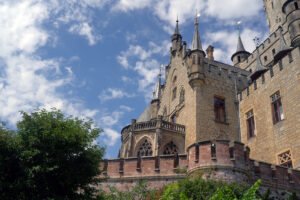 Marienburg Castle facade with turrets against blue sky