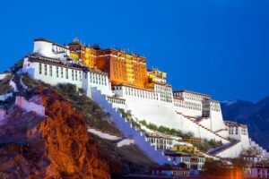 Potala Palace on hillside glowing at dusk
