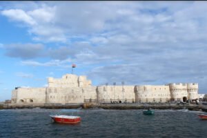 Qaitbay Citadel overlooking Mediterranean with boats in foreground