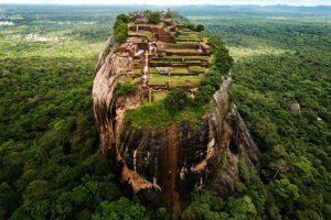 Aerial view of Sigiriya rock fortress atop jungle plateau