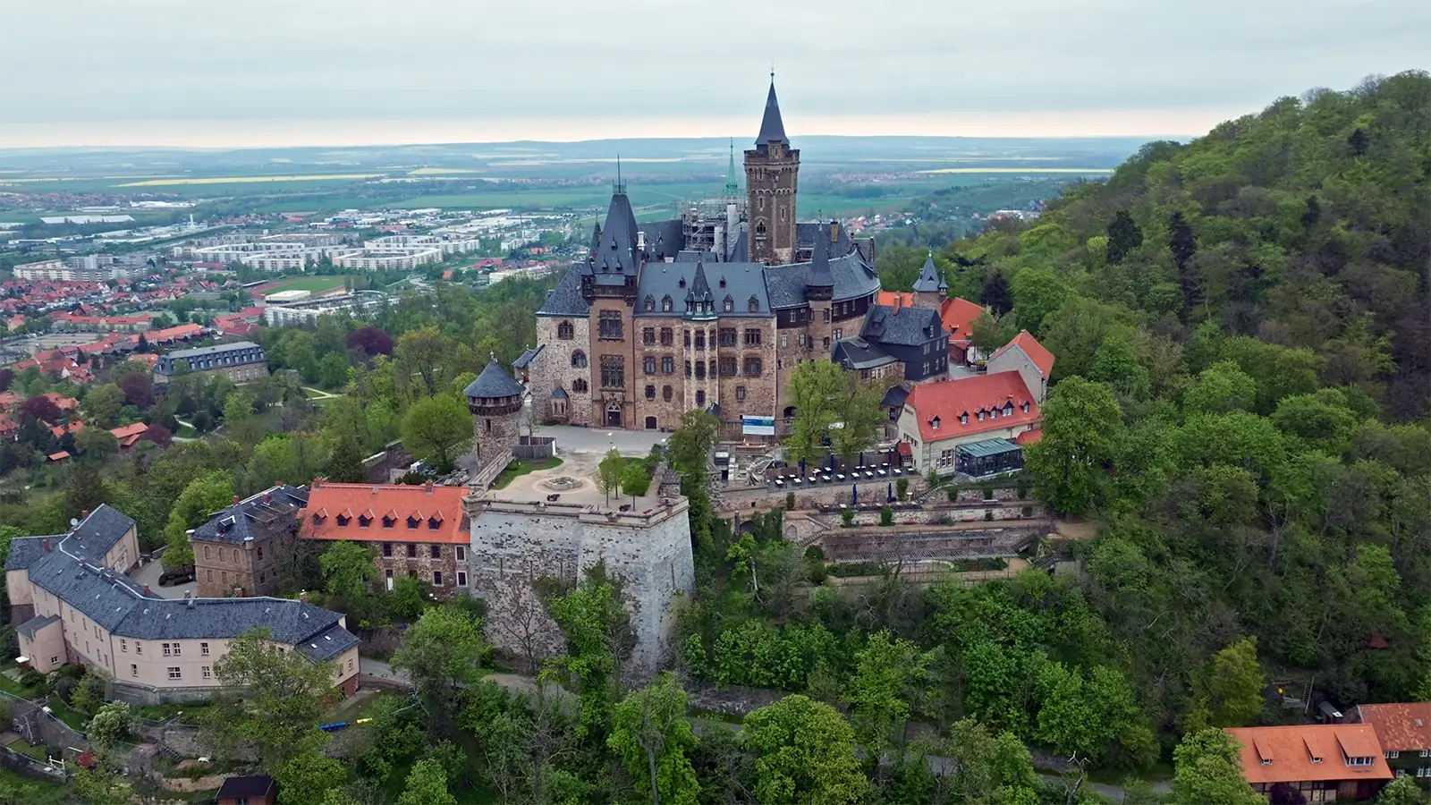 Aerial view of Wernigerode Castle perched above the Harz forests and town