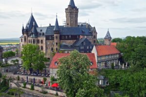Wernigerode Castle atop a hill with timbered houses