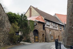 Stone courtyard gate and timbered house at Wernigerode Castle