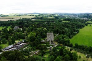 Aerial view of Blarney Castle surrounded by green parkland