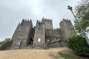 Castle of Guimaraes gray stone walls under cloudy sky