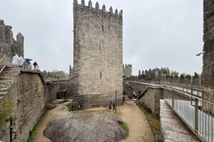 Castle of Guimaraes inner courtyard with tall keep and walkways