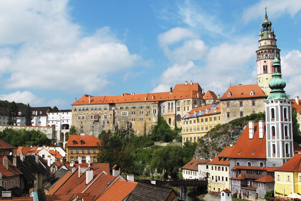 View of Český Krumlov Castle above red-roofed historic town and river