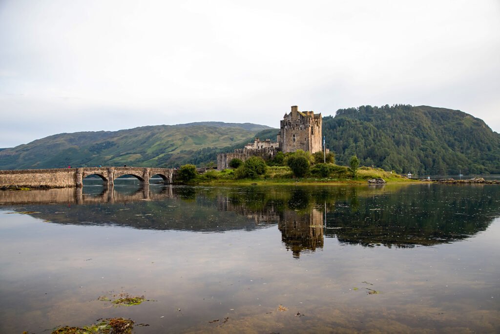 Eilean Donan Castle reflected in calm loch waters