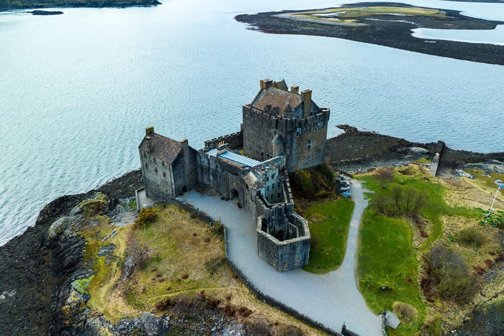 Aerial view of Eilean Donan Castle on rocky tidal island