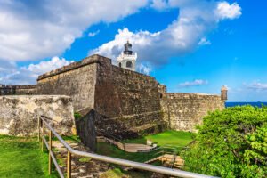 El Morro fortress walls and lighthouse under bright sky