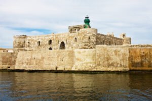 View of Maniace Castle fortress and lighthouse on Syracuse seafront
