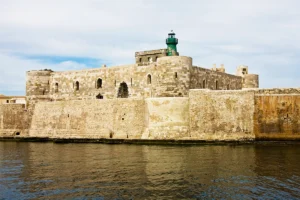 View of Maniace Castle fortress and lighthouse on Syracuse seafront