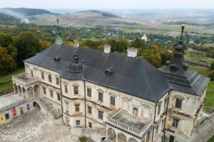 Aerial view of Pidhirtsi Castle perched above rolling fields