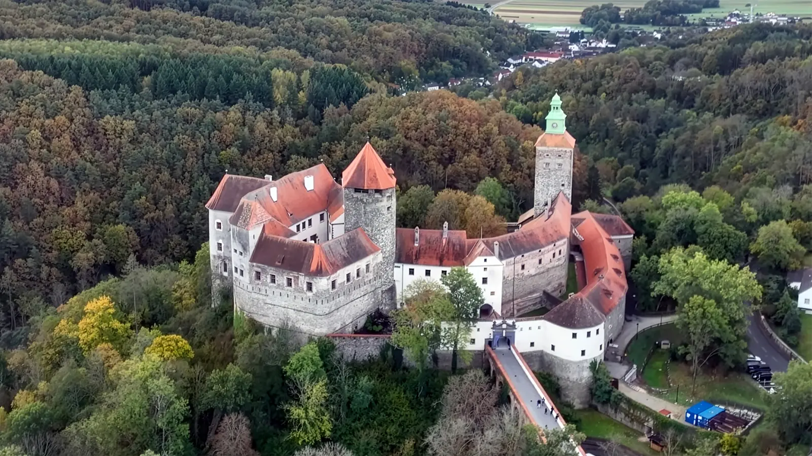 Aerial view of Schlaining Castle on wooded hill