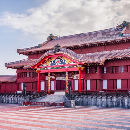 Shurijo Castle red main hall under pastel sky, wide courtyard
