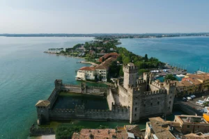 Aerial view of Sirmione Castle surrounded by Lake Garda