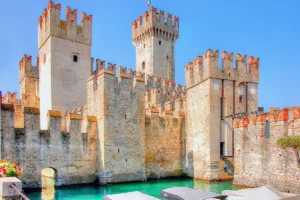 Sirmione Castle lakeside walls and tower, turquoise water