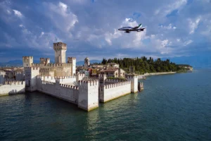 Sirmione Castle waterfront with jet plane overhead