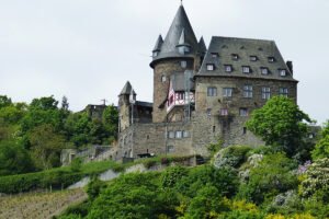 Stahleck Castle perched above vineyard-covered Rhine hillside