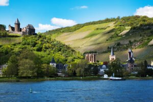 Stahleck Castle on hill above Rhine and vineyards