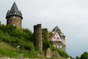 Stahleck Castle above vineyard-covered slope with round tower