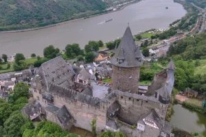 Aerial view of Stahleck Castle above river Rhine and town