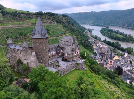 Stahleck Castle on hill above Rhine valley and village