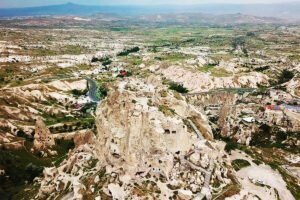Aerial view of Uçhisar Castle and Cappadocia rock formations