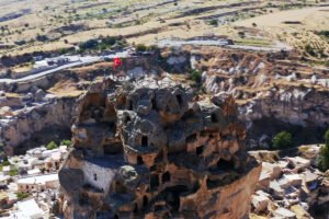 Uçhisar Castle rock fortress with carved rooms, aerial view