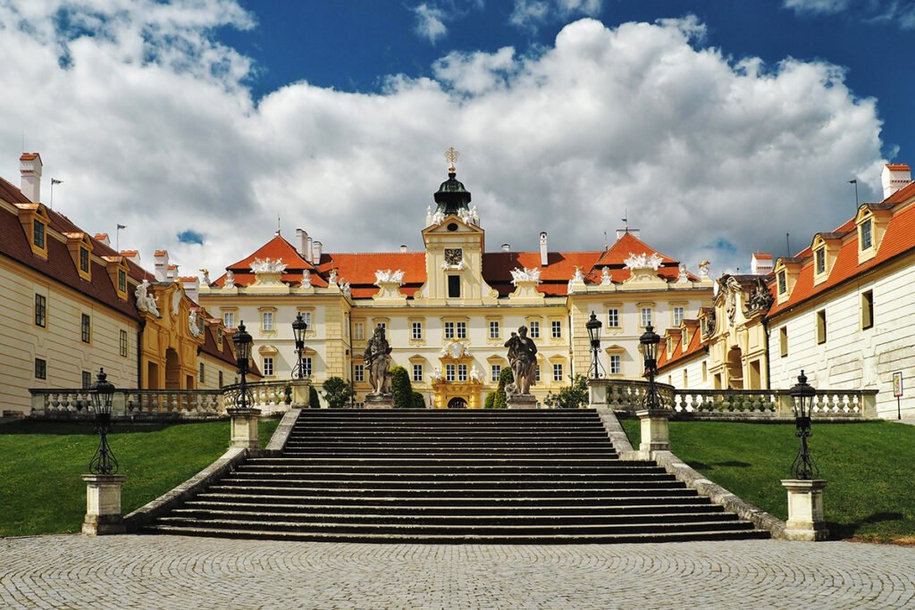Front steps leading to Valtice Castle under dramatic clouds