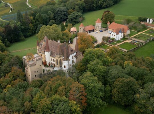 Aerial view of Gorgier Castle among trees