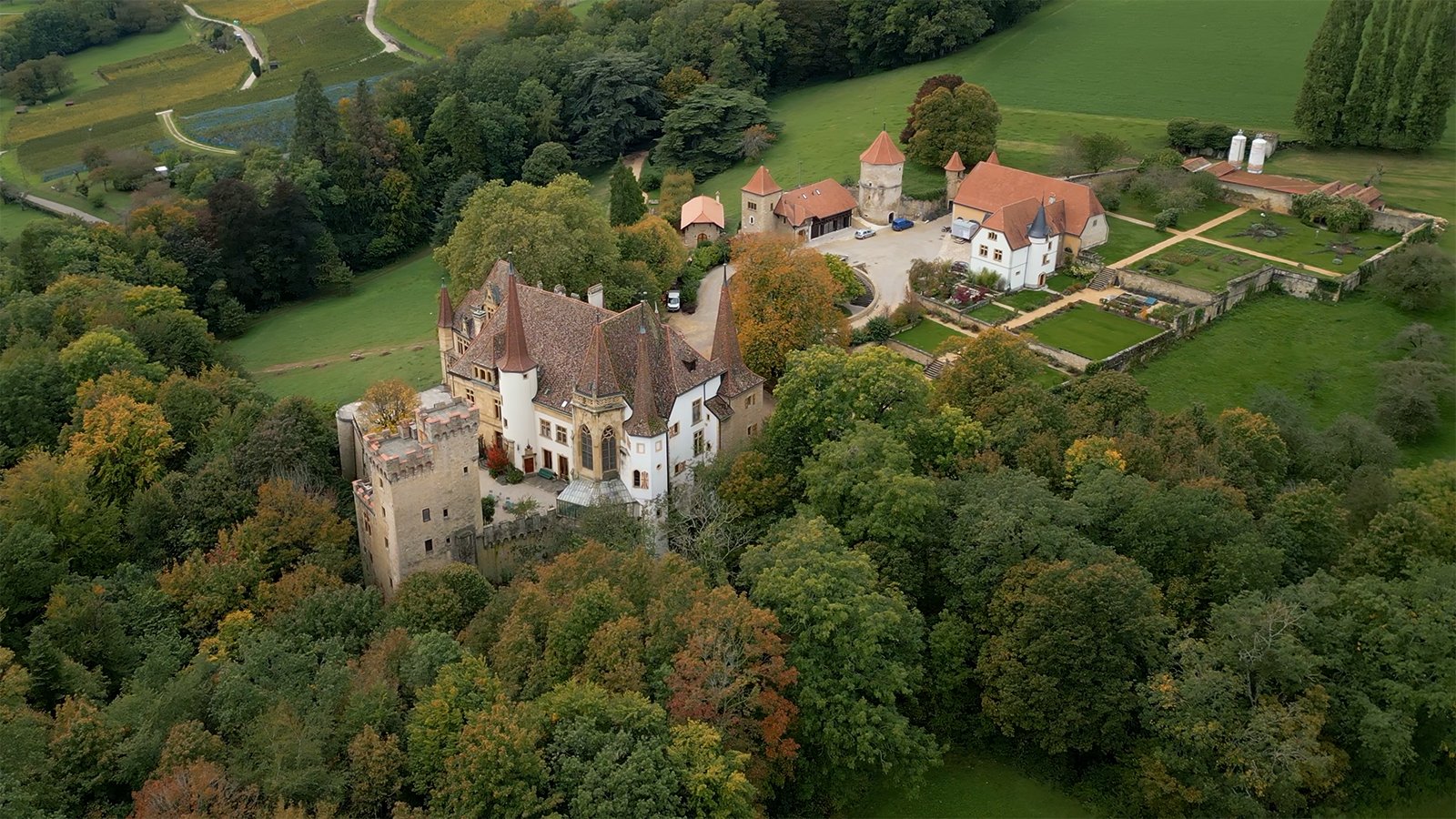 Aerial view of Gorgier Castle among trees