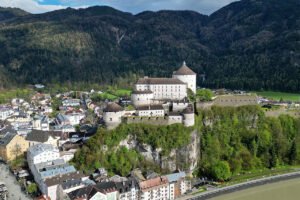 Aerial view of Kufstein Fortress perched above town and river