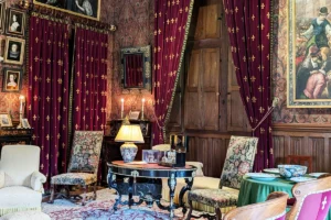 Ornate château salon at Azay‑le‑Rideau with velvet curtains
