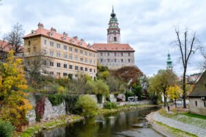 Cesky Krumlov Castle above the Vltava River with autumn trees